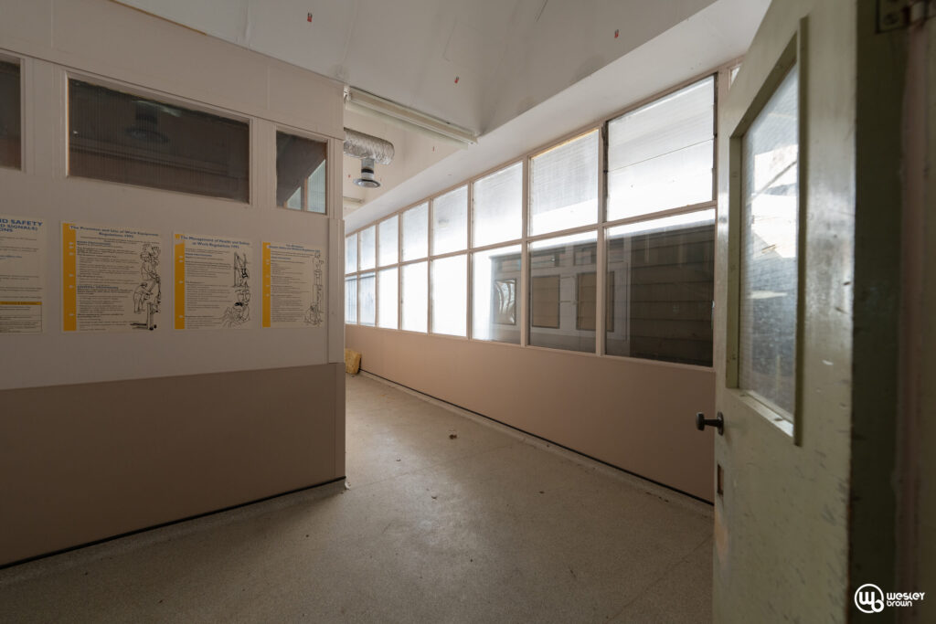 Broadmoore Hospital - Empty Hallway in Broadmoor Hospital Interior hallway of Broadmoor Hospital featuring safety posters on the wall.