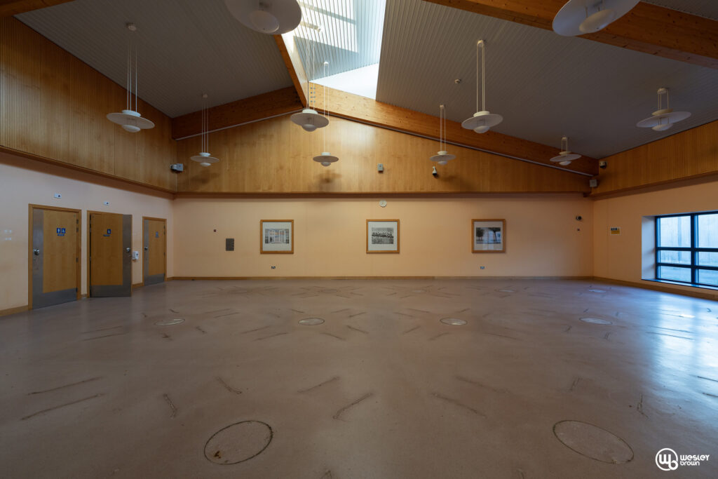 Broadmoore Hospital_34 copy Spacious interior of a modern hospital room with wooden accents and high ceiling.
