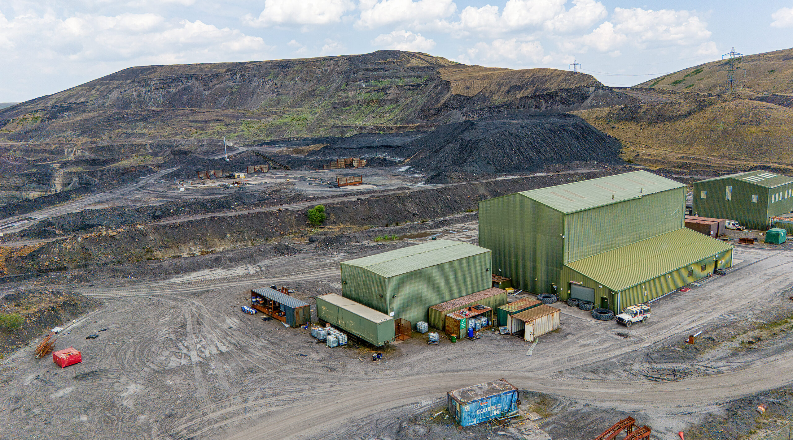 Drone photograph of an abandoned coal wash in Wales showing the derelict industrial buildings and surrounding landscape.